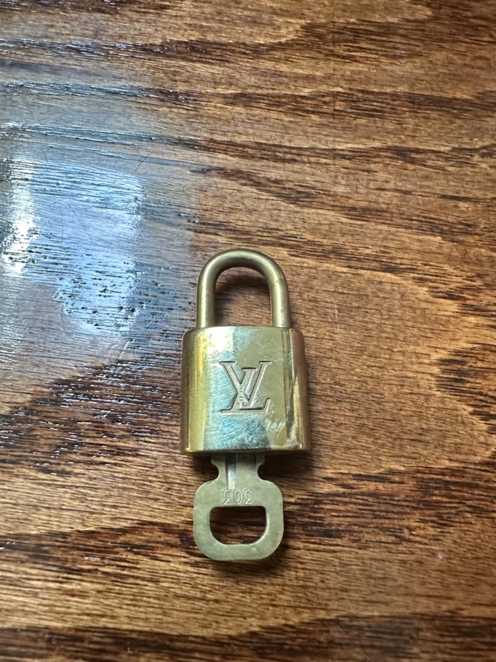 Louis Vuitton Brass Tone Padlock in Gold